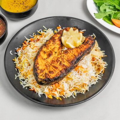 Grilled Salmon Fish Tender and juicy salmon fillet, grilled with herbs and spices. Served with veggies, lemon butter sauce, and your choice of rice or mashed potatoes.